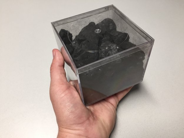 Austin Brown of the National Renewable Energy Lab keeps this hunk of coal on his desk as a reminder of what a kilowatt-hour of electricity actually is. Burning this softball sized piece of coal will give you roughly a kilowatt-hour worth of electricity. Photo courtesy of Austin Brown NREL.