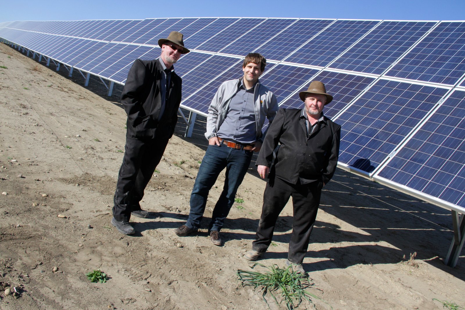 Highlight of 2015 - Dan Hofer, financial boss, David Vonesch of Skyfire Energy and Jake Hofer electrician with Green Acres Farm near Bassano, Alberta pose in front of their 2 megawatt solar farm that consists of more than 7,600 solar modules that produce the electricity to run Green Acre's recycling and farming operations. Photo David Dodge GreenEnergyFutures.ca