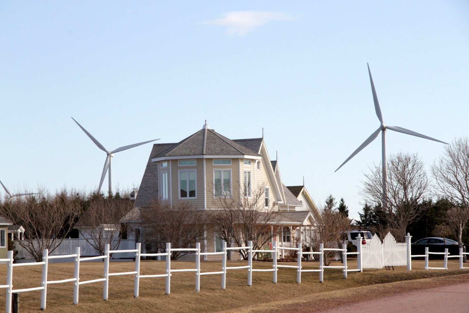 A beautiful home in West Cape PEI with the West Cape Wind Farm in the background. Islanders get an average of 26 per cent of their electricity from wind power. Virtually all of the rest comes from an inter-tie undersea cable to the New Brunswick grid. Photo David Dodge, GreenEnergyFutures.ca