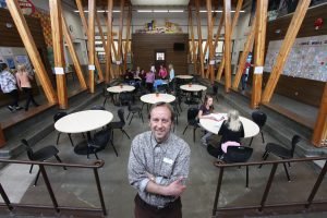 Brian Wityshyn, principal of Lawrence Grassi middle school in the common space of his energy efficient school. The school was designed to achieve LEED silver status on a budget but the district now thinks it will achieve LEED gold status. Photo David Dodge