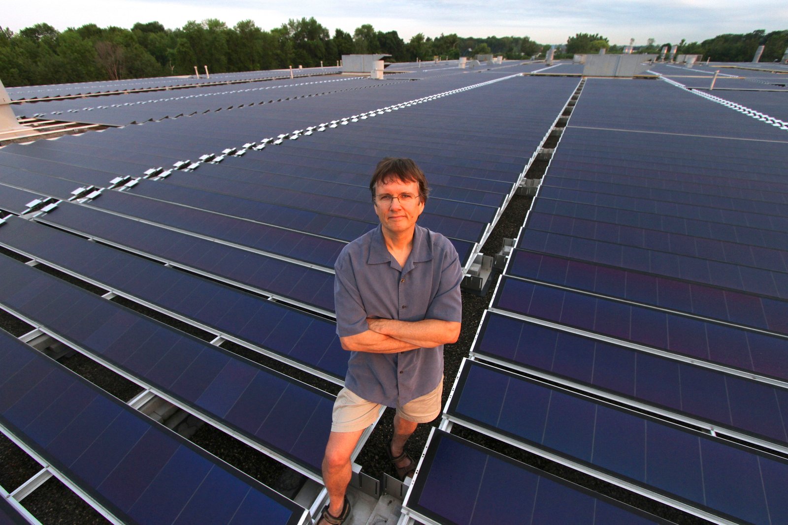 Mike Brigham, the president of Solar Share, at its WaterView facility. Located on the roof of a bus manufacturing plant it has 438kw of thin-film solar.