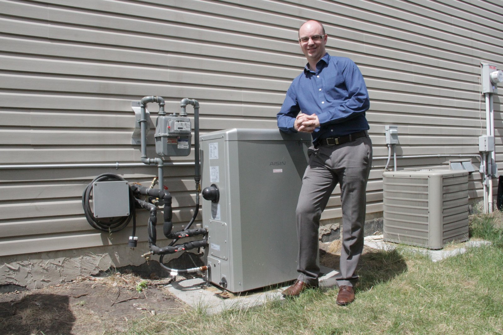 Greg Caldwell with micro cogen unit