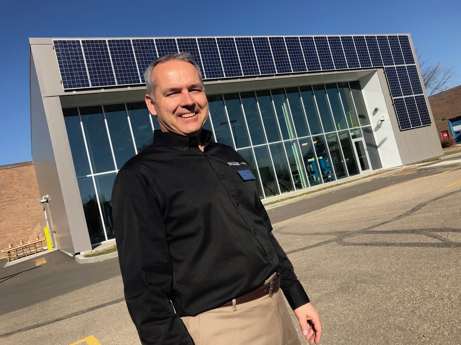 Joel Gingrich with Alternative Energy Lab behind