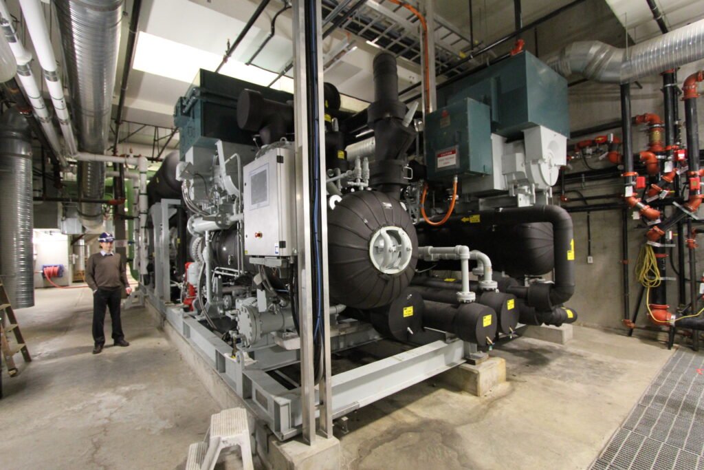 404. Toronto Western Hospital to get 90% of its Heat from the Sewer and Heat Pumps 7 Chris Baber shows the heat pumps that provide 3.2 MW of heat for hot water and heating from sewage at the False Creek Energy Centre 13