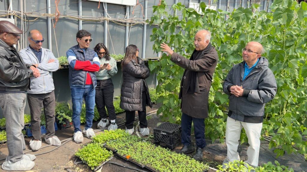 Sadru explains passive solar greenhouse inside