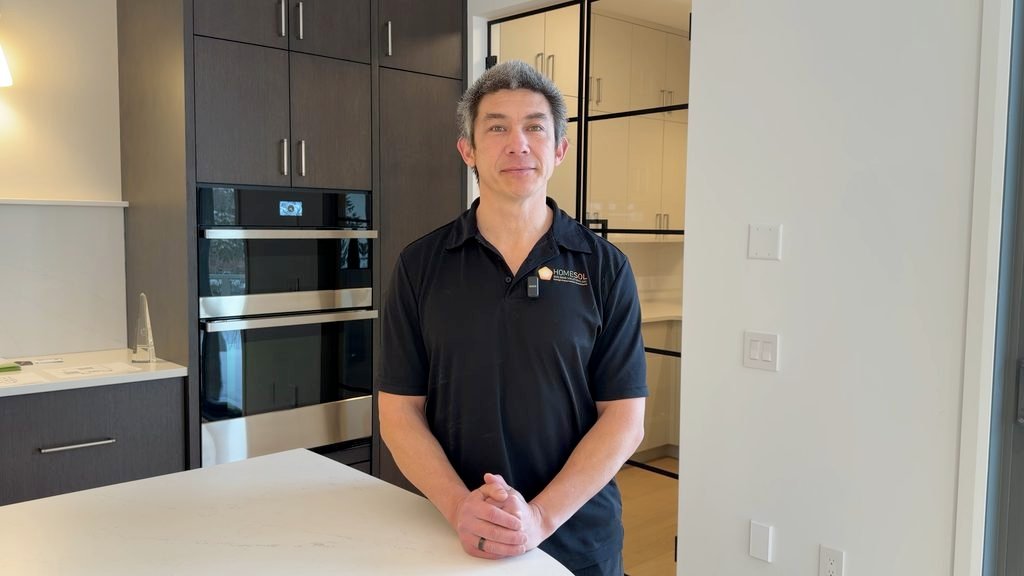 Stephen Magneron Standing at Counter